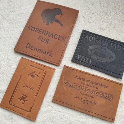 Customizable Embossed Leather Patches using eco friendly top grain leather with blind embossing and color filled embossing techniques for finish